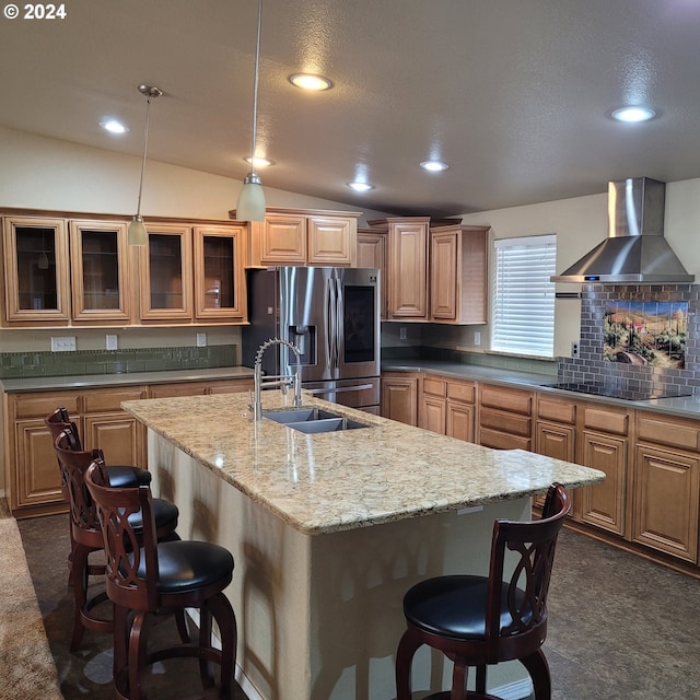 kitchen featuring black electric cooktop, dark colored carpet, wall chimney range hood, and stainless steel refrigerator with ice dispenser