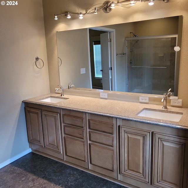 bathroom with vanity and an enclosed shower