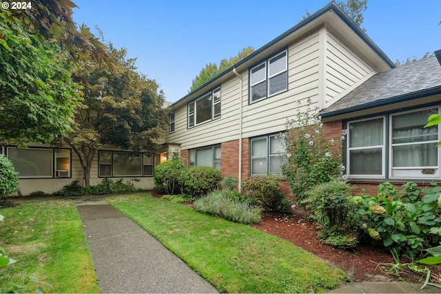 view of front of home with a front yard