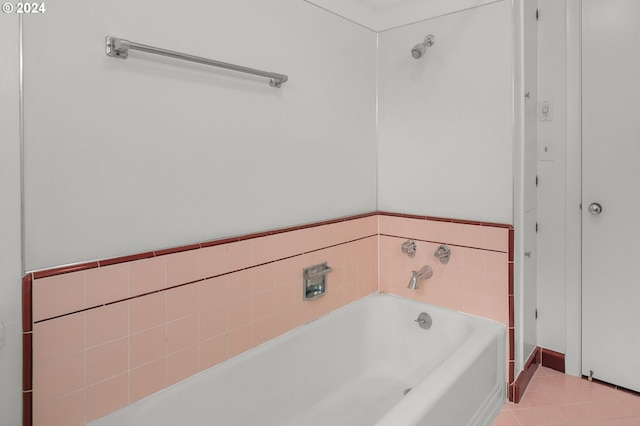 bathroom featuring a washtub and tile patterned floors