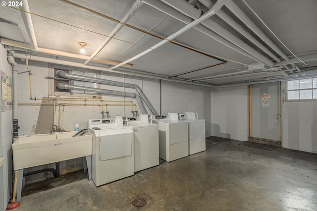 basement with sink and independent washer and dryer