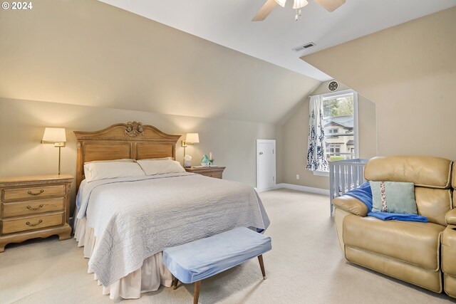 carpeted bedroom with ceiling fan and lofted ceiling