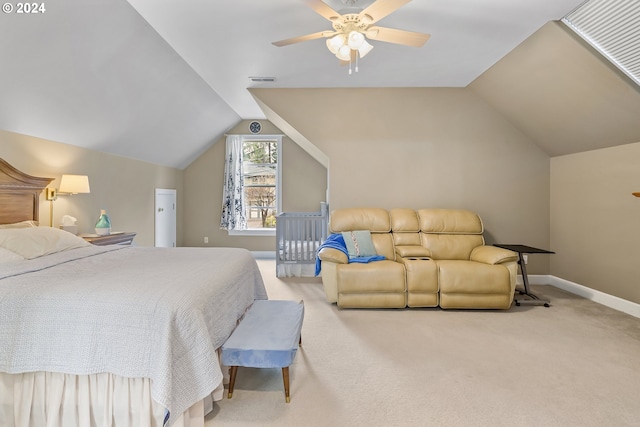 carpeted bedroom with ceiling fan and vaulted ceiling