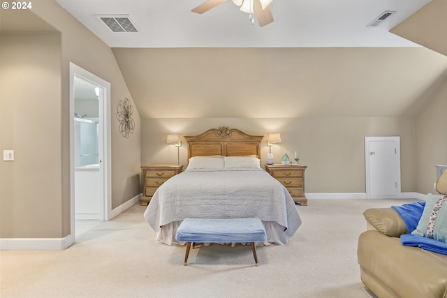 carpeted bedroom featuring lofted ceiling, ceiling fan, and ensuite bathroom