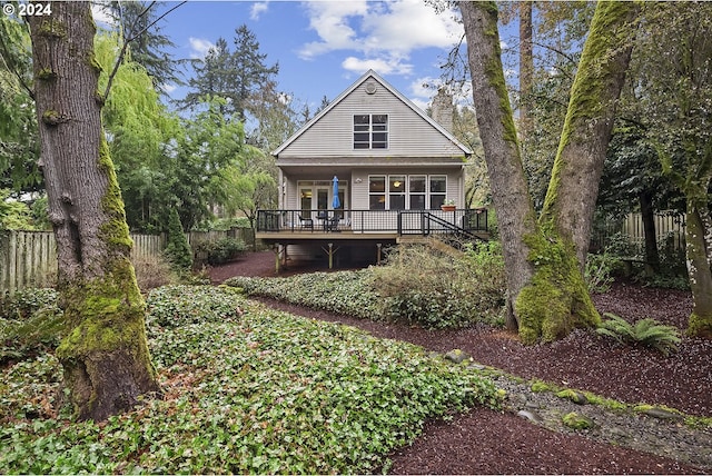 back of house featuring a porch