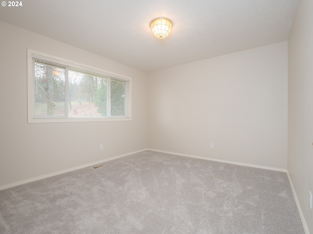 empty room with carpet floors