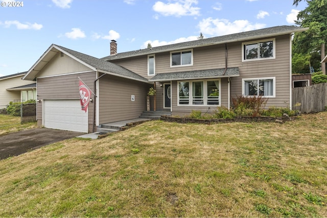 view of front facade with a garage and a front yard