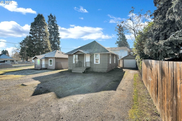 bungalow-style house with an outbuilding and a garage