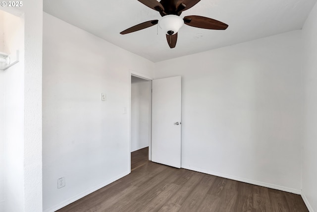 unfurnished room with hardwood / wood-style floors and ceiling fan