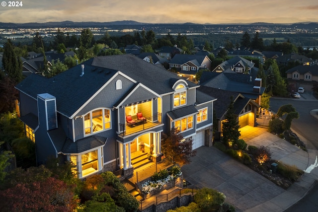 view of front of house with a balcony and a garage