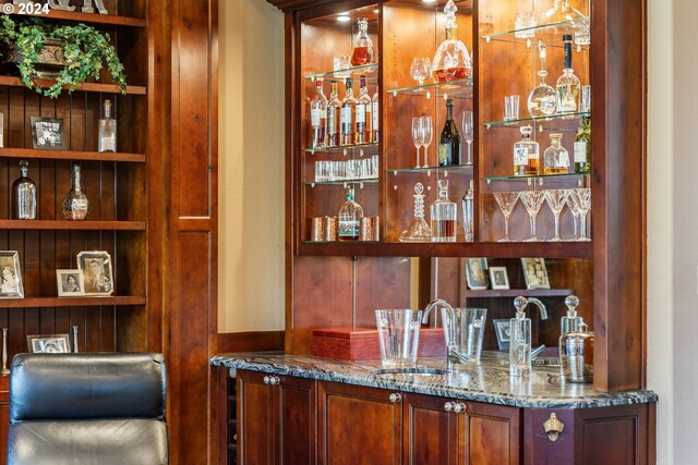 bar with sink and stone counters