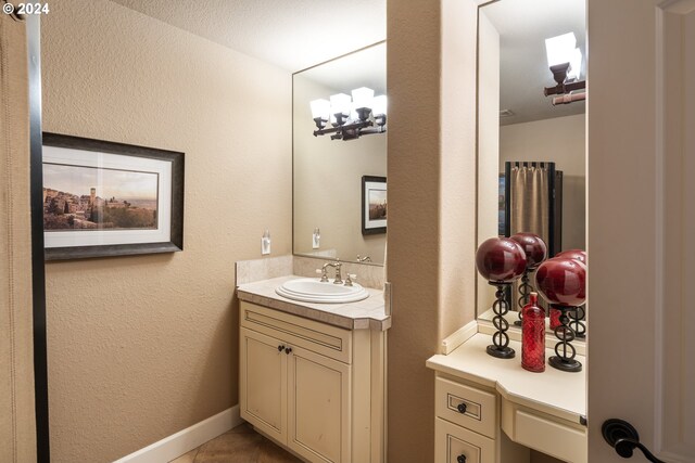 home office with light colored carpet, built in desk, and a textured ceiling