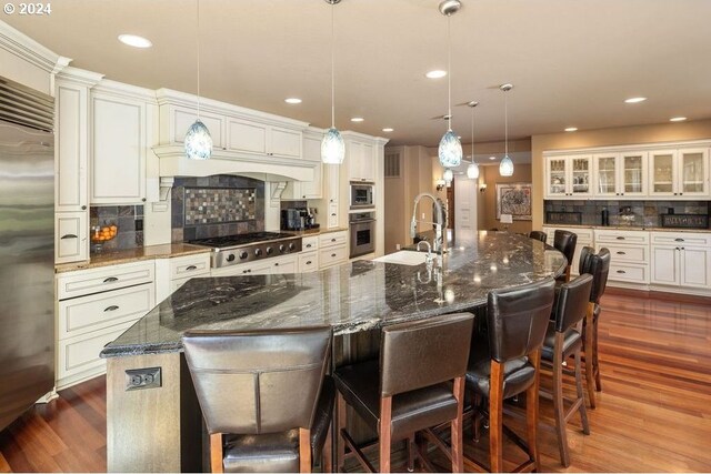 bar featuring sink and stone countertops