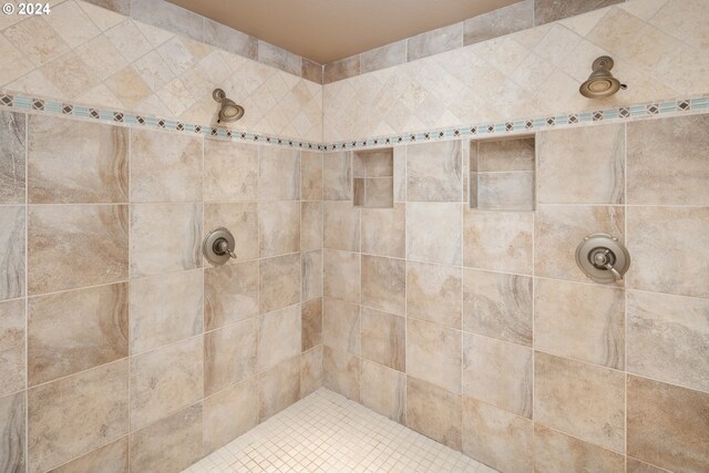 bathroom featuring ornate columns, independent shower and bath, and vanity