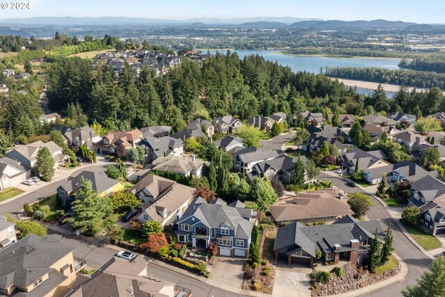 aerial view featuring a water and mountain view