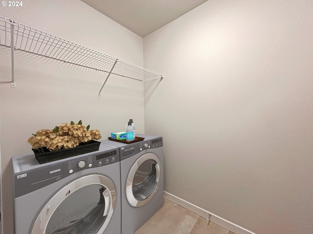 washroom with washer and dryer