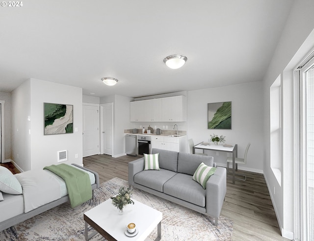 living room with sink and light wood-type flooring