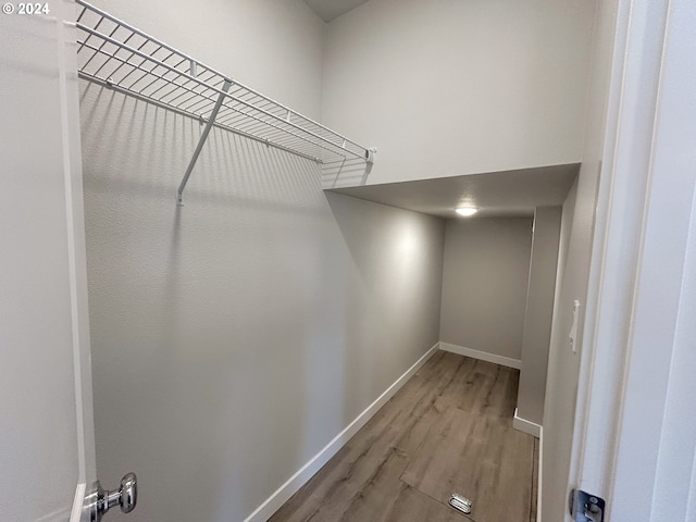 walk in closet featuring wood-type flooring