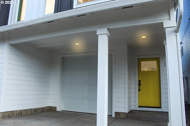 entrance to property featuring a garage