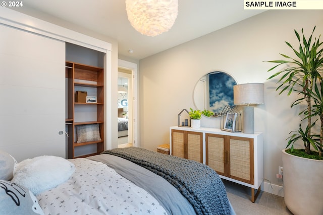 carpeted bedroom featuring a closet