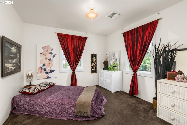 bedroom featuring visible vents and carpet flooring