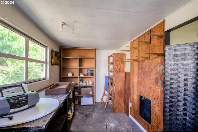 office featuring concrete floors and a fireplace