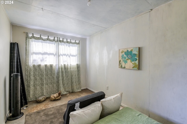 bedroom featuring concrete floors