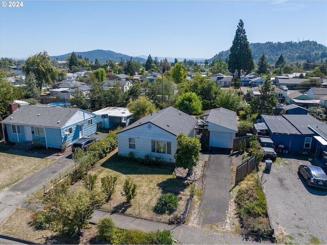 birds eye view of property with a mountain view and a residential view