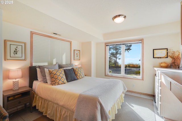 bedroom with visible vents and baseboards