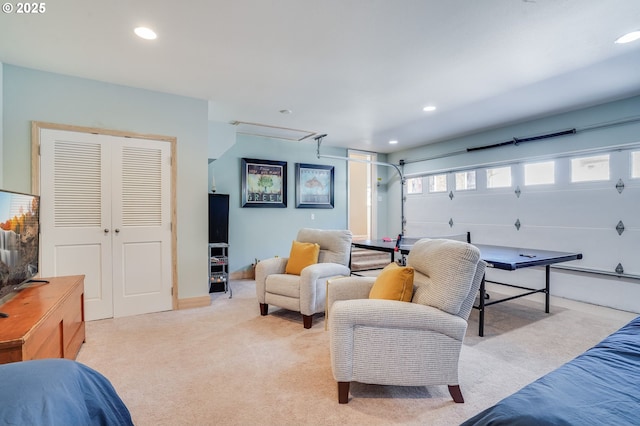 recreation room with a garage, recessed lighting, and light colored carpet