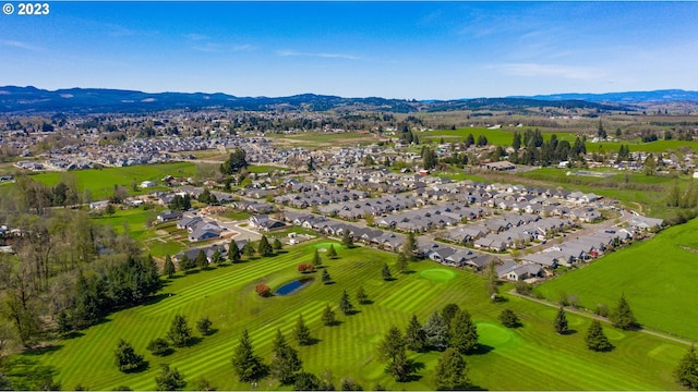 birds eye view of property featuring a mountain view