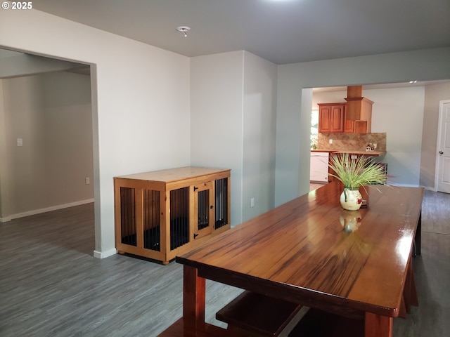 85287 Hemlock St, Florence, OR 97439 - dining area featuring baseboards and wood finished floors