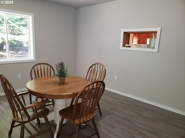 85287 Hemlock St, Florence, OR 97439 - dining space featuring baseboards and dark wood-style flooring