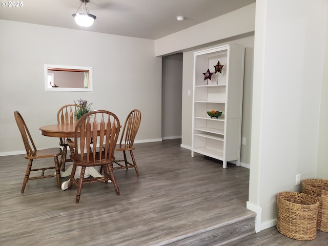 85287 Hemlock St, Florence, OR 97439 - dining space featuring wood finished floors and baseboards