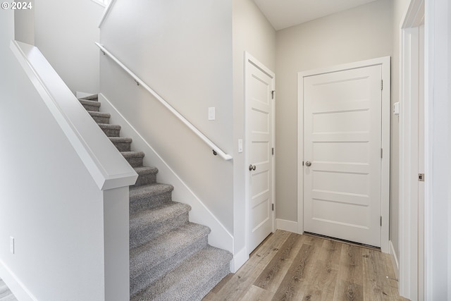 foyer entrance with light hardwood / wood-style floors