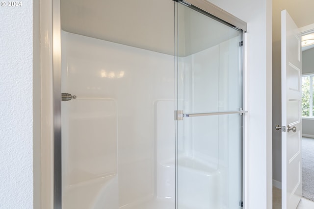 bathroom featuring an enclosed shower