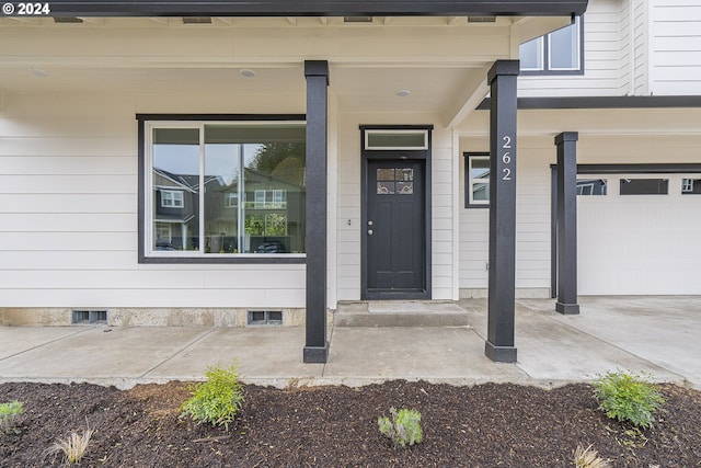 doorway to property featuring a garage