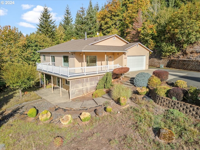 12405 SW Poppy Dr, Gaston, OR 97119 - view of front of home with an attached garage, concrete driveway, and roof with shingles