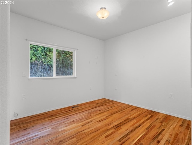 12405 SW Poppy Dr, Gaston, OR 97119 - unfurnished room featuring light wood-style flooring and baseboards