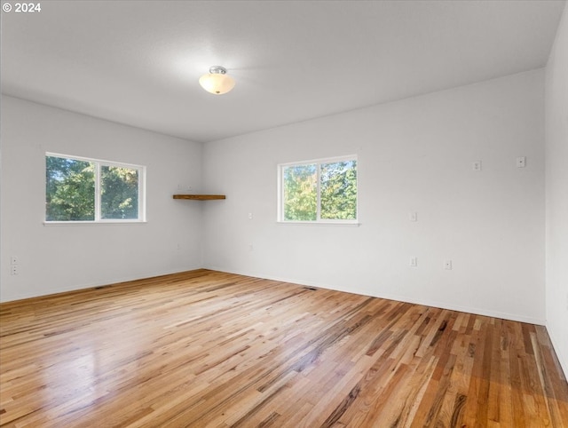 12405 SW Poppy Dr, Gaston, OR 97119 - empty room with light wood-style floors and baseboards