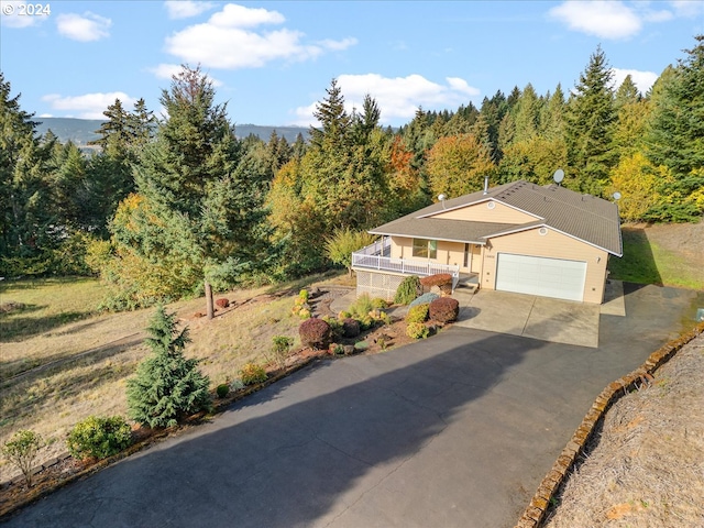 12405 SW Poppy Dr, Gaston, OR 97119 - view of front of property with driveway, a wooded view, and a garage