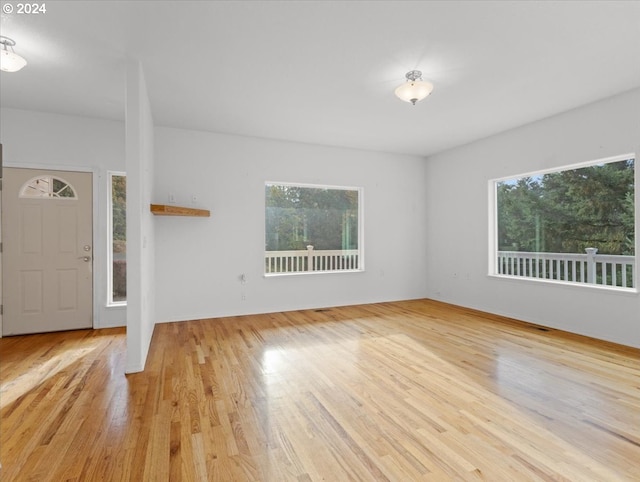 12405 SW Poppy Dr, Gaston, OR 97119 - unfurnished living room with healthy amount of natural light and wood finished floors