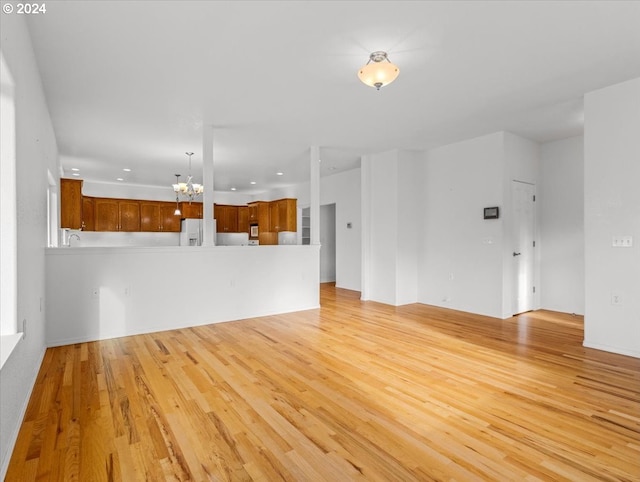 12405 SW Poppy Dr, Gaston, OR 97119 - unfurnished living room featuring a chandelier, light wood-style flooring, and recessed lighting