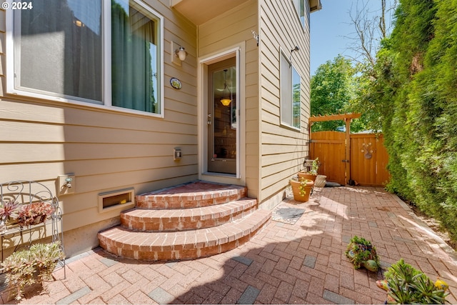 entrance to property with a patio area