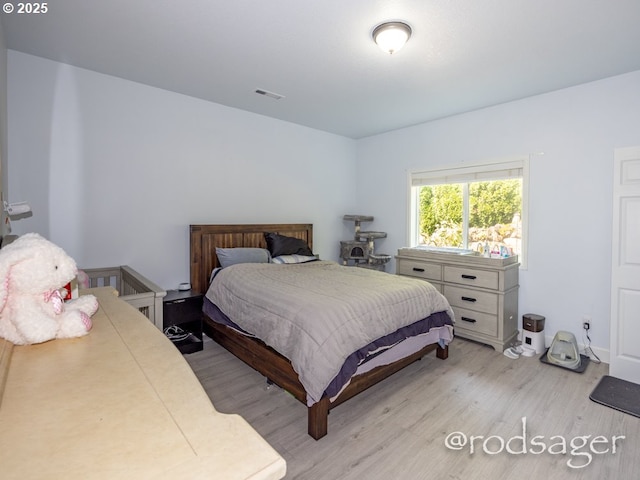 bedroom with light wood-type flooring