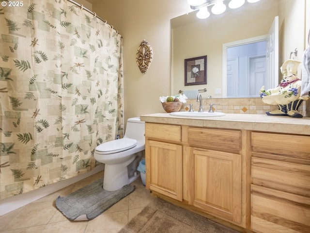 bathroom featuring tile patterned flooring, toilet, decorative backsplash, vanity, and a shower with shower curtain