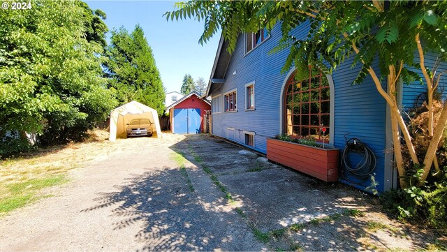 view of home's exterior featuring an outdoor structure