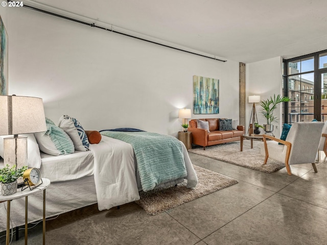 bedroom featuring concrete floors