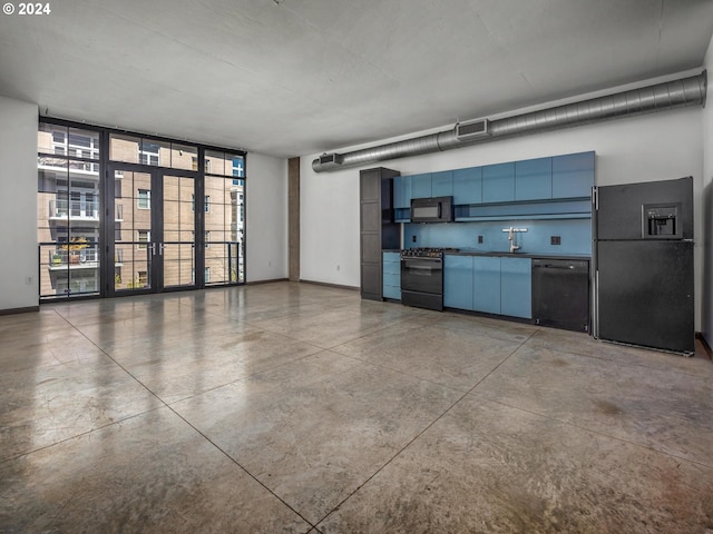 kitchen with black appliances, visible vents, baseboards, and concrete flooring