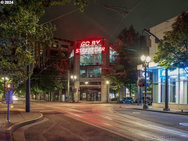 view of street with street lighting, curbs, and sidewalks